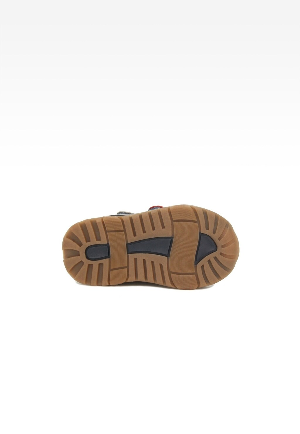 Podeszwa trzewików dziecięcych BARTEK 11689002 w kolorze brązowym z czarnymi wstawkami, zapewniająca trakcję i wytrzymałość, idealna dla chłopców w modelu granatowo-beżowym.