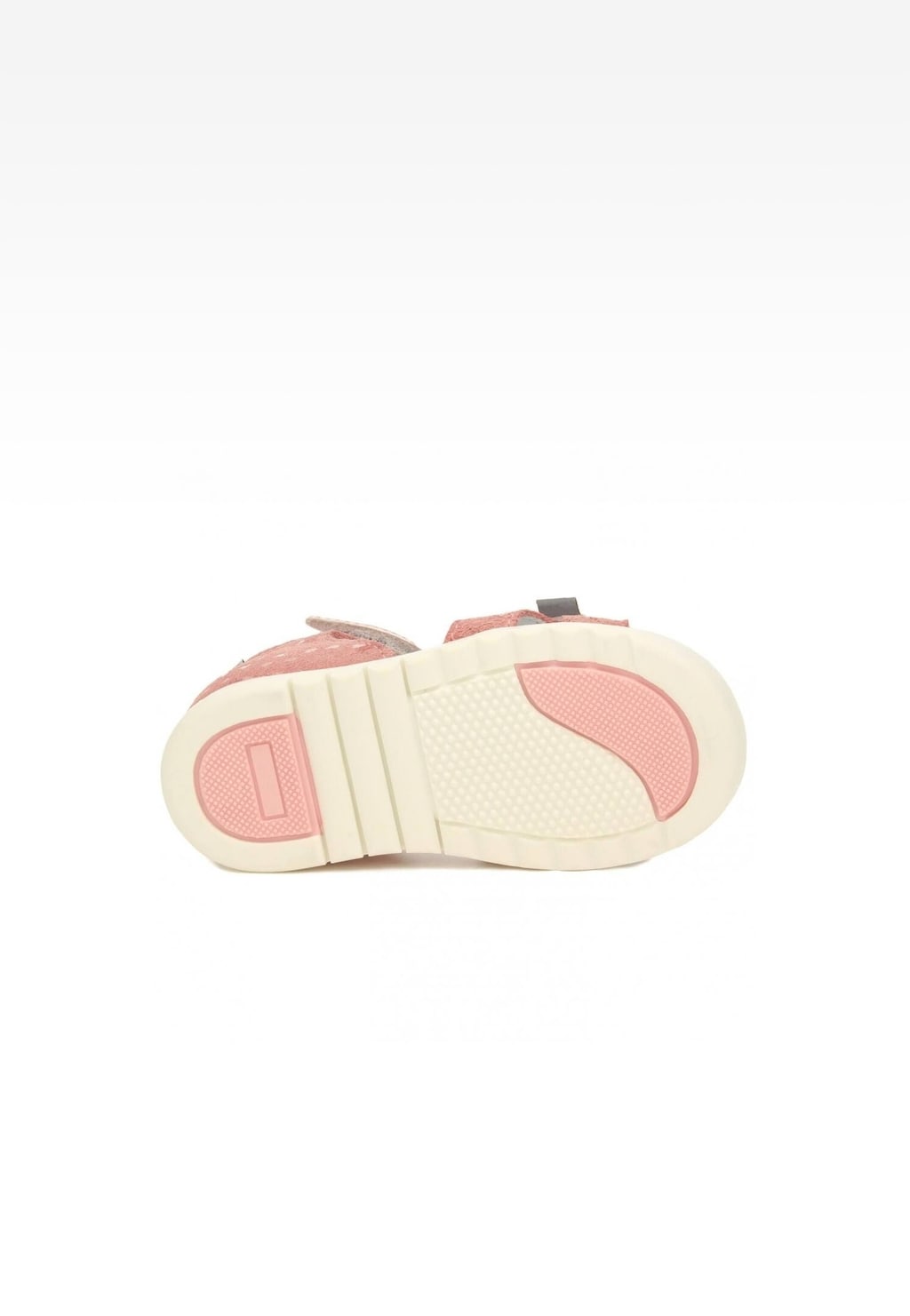 Podeszwa jasnoróżowych sandałów BARTEK 11414007 dla dziewcząt z elastyczną, jasną podeszwą i różowymi elementami antypoślizgowymi, widoczna od spodu.