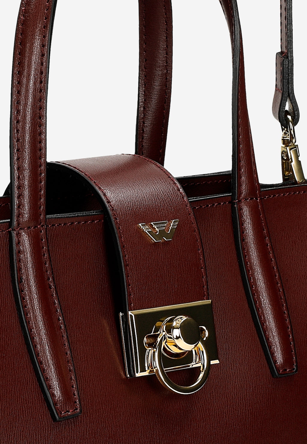 Bordowy skórzany kuferek Wojas model 80404-55 z eleganckim złotym zapięciem i metalowym logo marki. Zbliżenie na detale torebki i uchwyt.