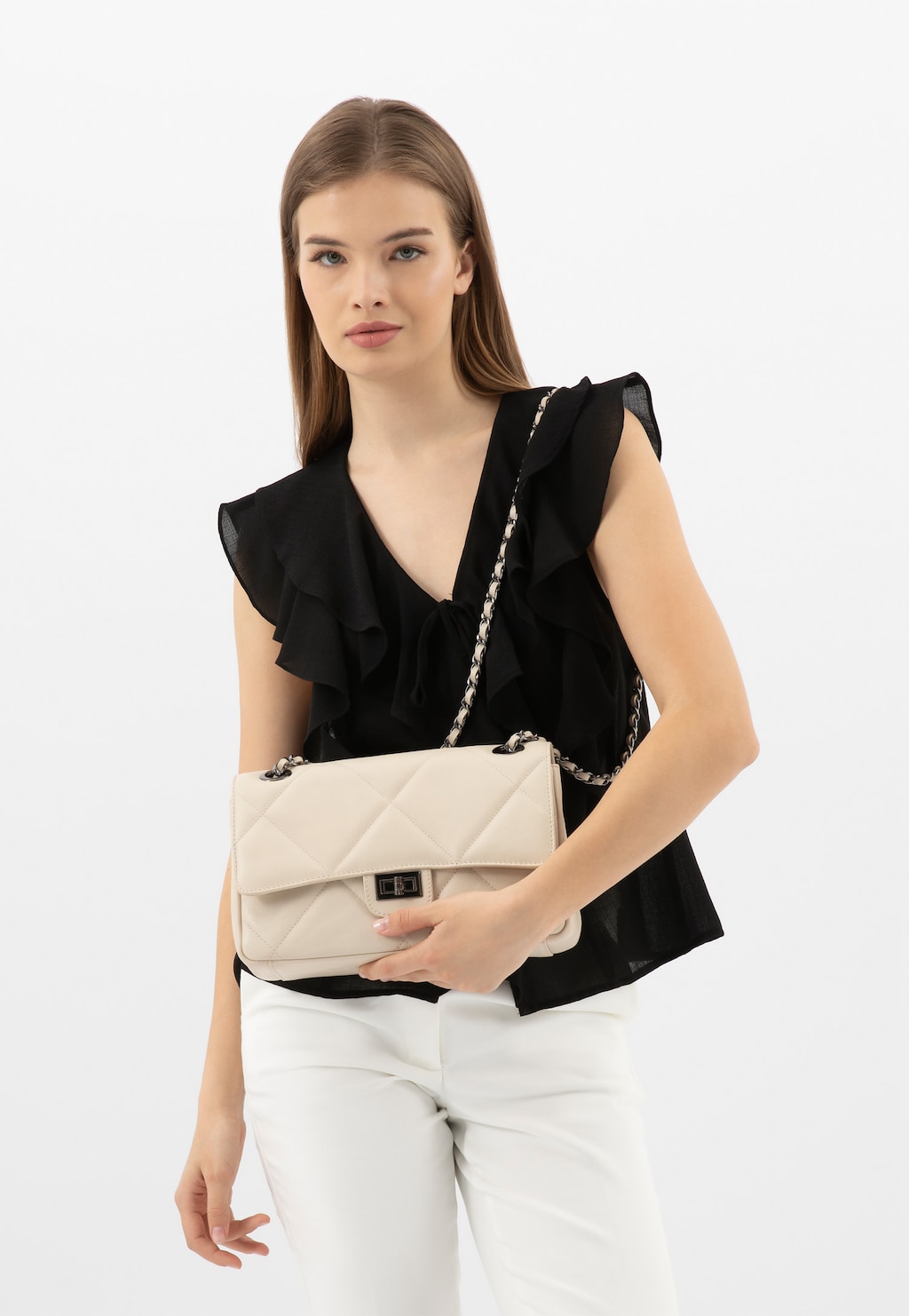 Jasnobeżowa pikowana torebka damska ze skóry licowej 80342-54 Widok 1