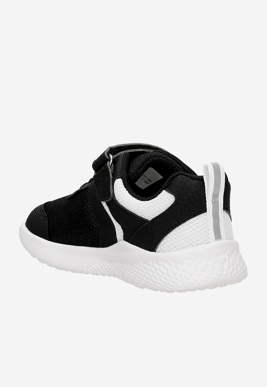 Czarne sneakersy dziecięce Bartek 87003-10 z białymi wstawkami, białą podeszwą i zapięciem na rzep, widok z tyłu pod kątem.