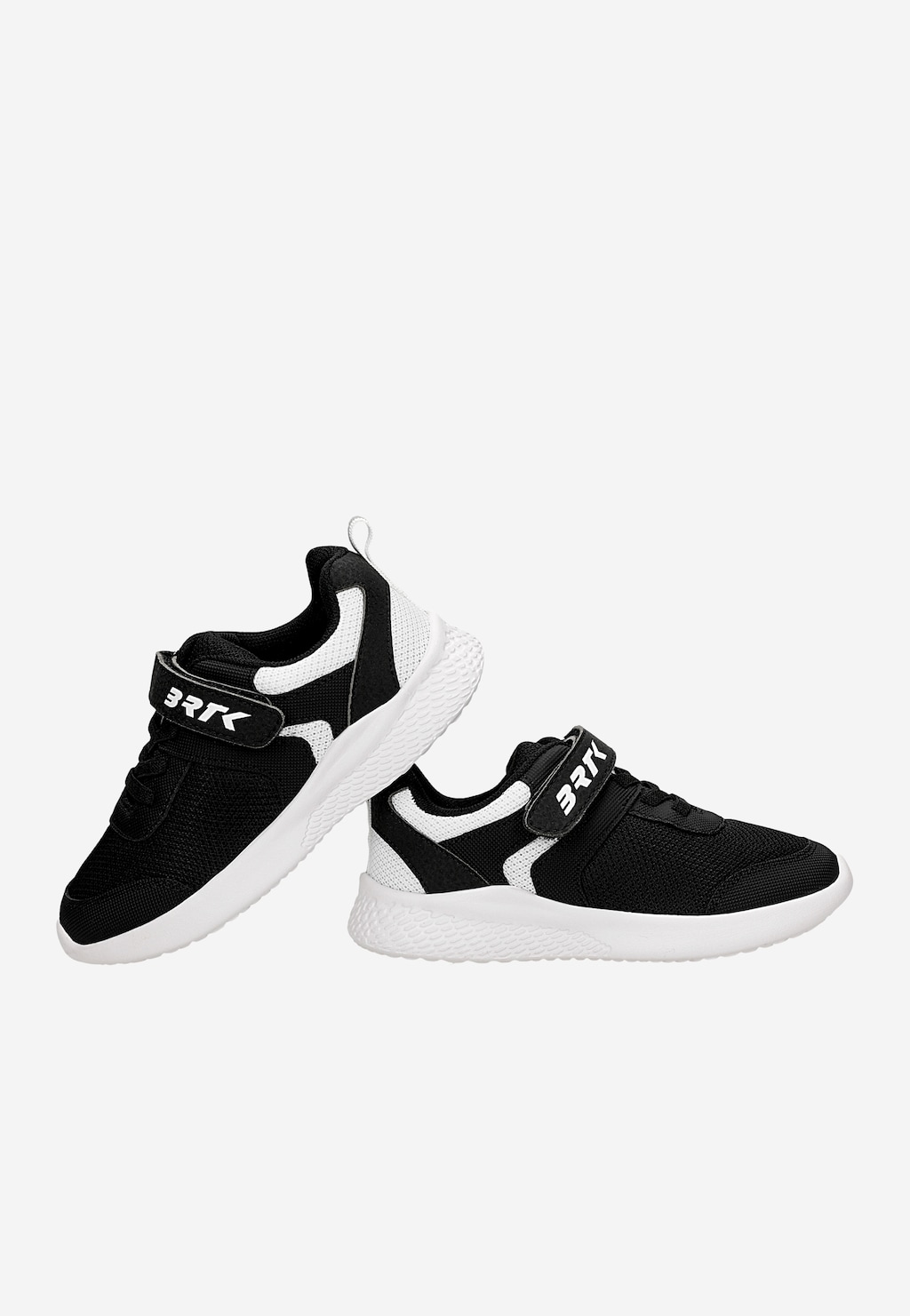 Czarne sneakersy dziecięce Bartek 87003-10 z białymi wstawkami, rzepem z logo BRTK i białą podeszwą, widok z boku.