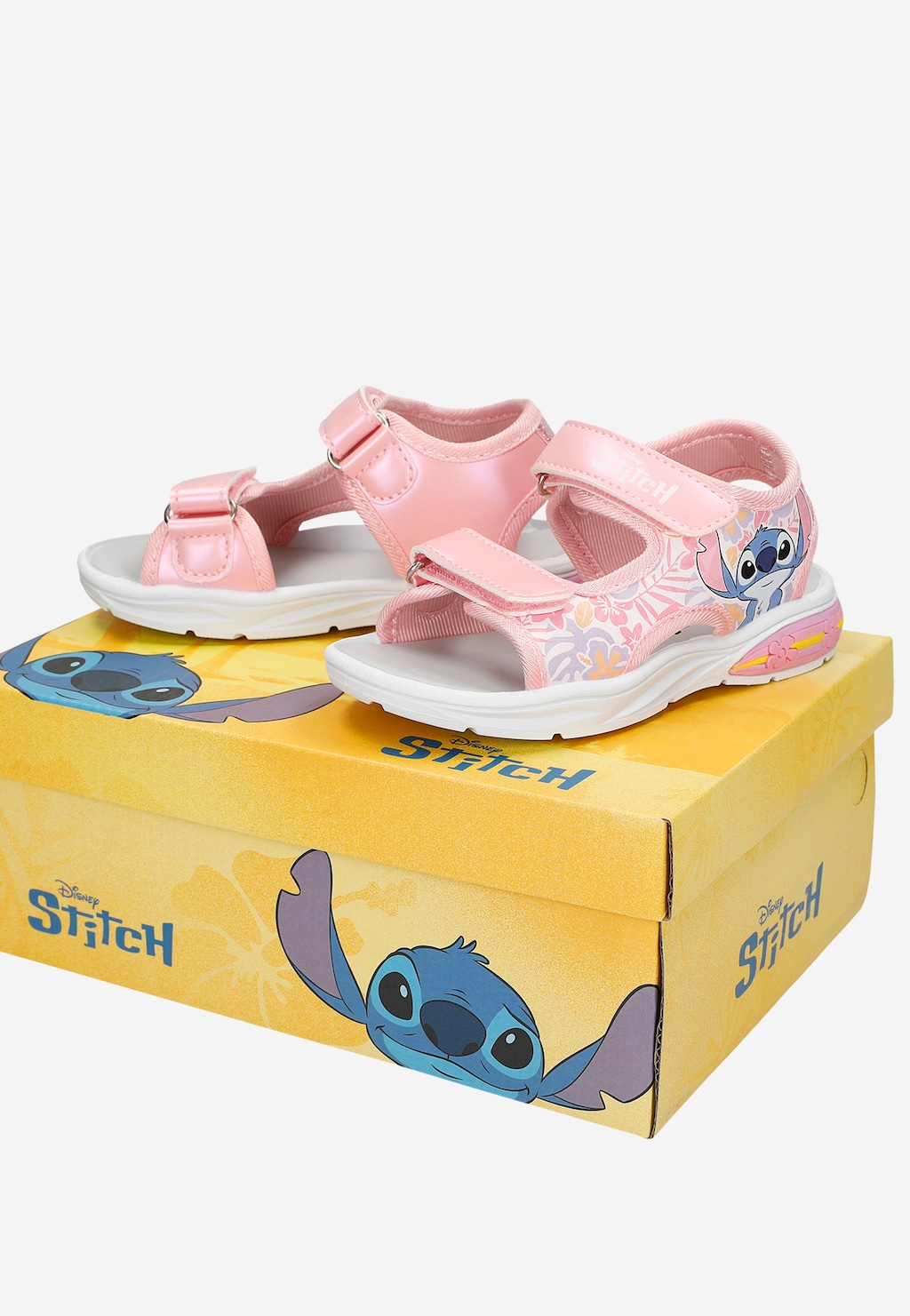 Różowe sandały dziewczęce Bartek Stitch 89007-15 ze świecącą podeszwą na żółtym pudełku Disney Stitch, zapięcie na rzepy, wzór z postacią Stitcha.