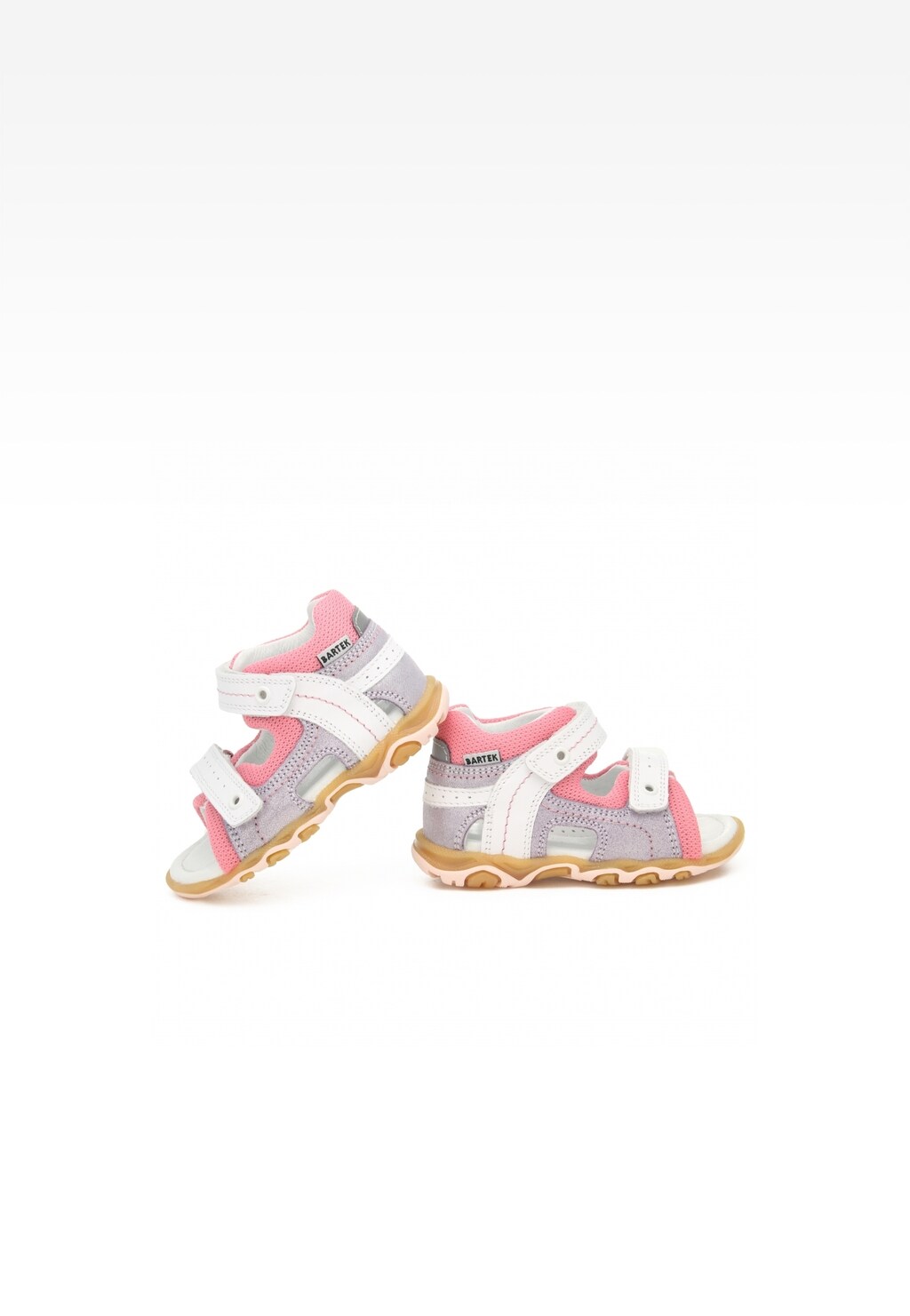 Dziewczęce sandały Bartek 11848-003 w biało-różowym kolorze z zapięciem na rzepy, gumową podeszwą i stabilnym zapiętkiem, idealne na letnie spacery.
