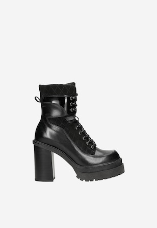 Women's black biker boots made of combined leathers on heel