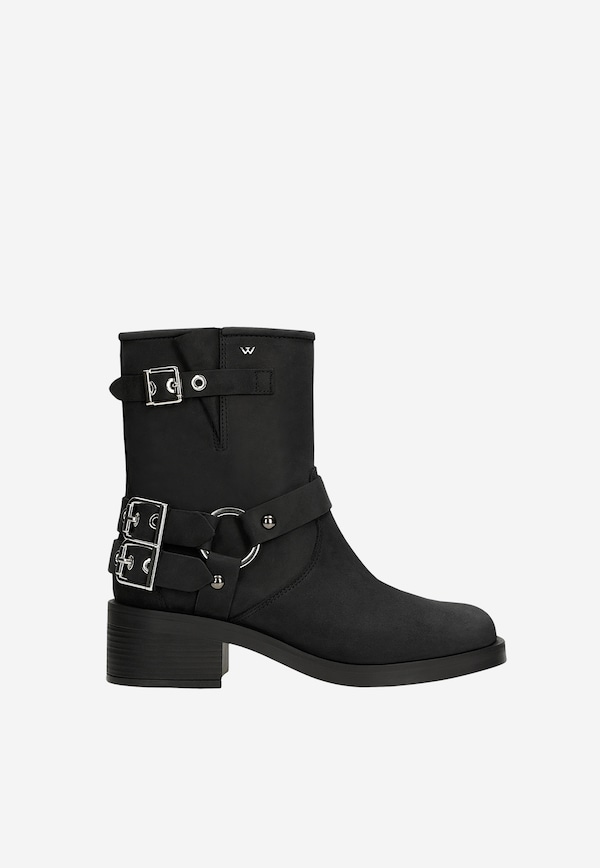 Black leather biker boots with metal accents