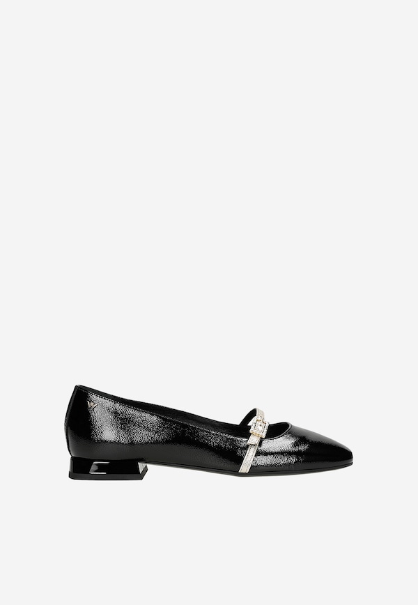 Black patent ballet flats with a golden strap