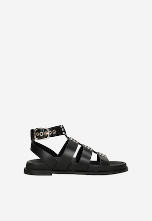 Czarne skórzane rzymianki ze złotymi nitami